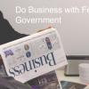 Man with newspaper and Do business with federal governments text